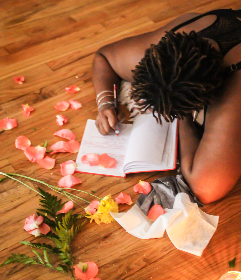 Journaling among scattered rose petals
